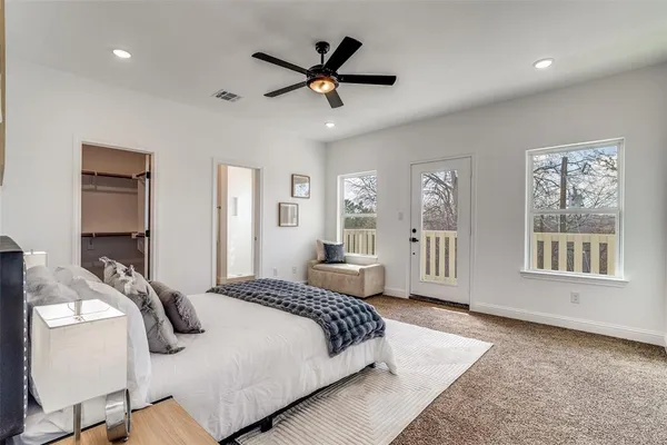 a bedroom with a bed and window