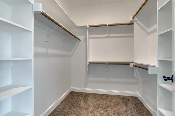 a view of an empty walk in closet