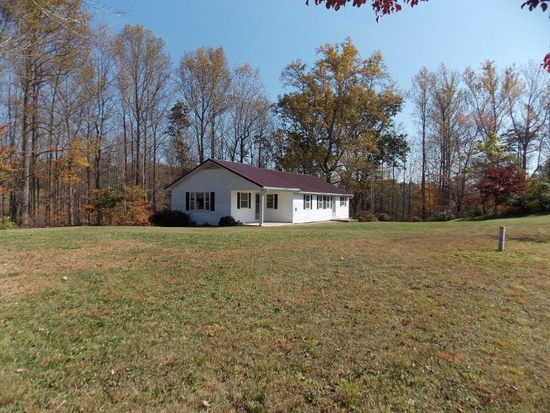 156 Rose Wood Road Woolwine, VA 24185 - Photo 2 of 29 a front view of house with yard and trees