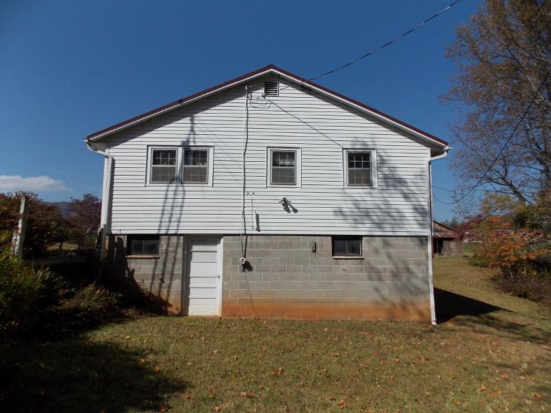156 Rose Wood Road Woolwine, VA 24185 - Photo 13 of 29 a front view of a house with a yard