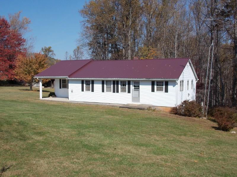 156 Rose Wood Road Woolwine, VA 24185 - Photo 15 of 29 a front view of a house with a garden