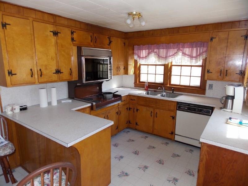 156 Rose Wood Road Woolwine, VA 24185 - Photo 26 of 29 a kitchen with a sink stove and microwave