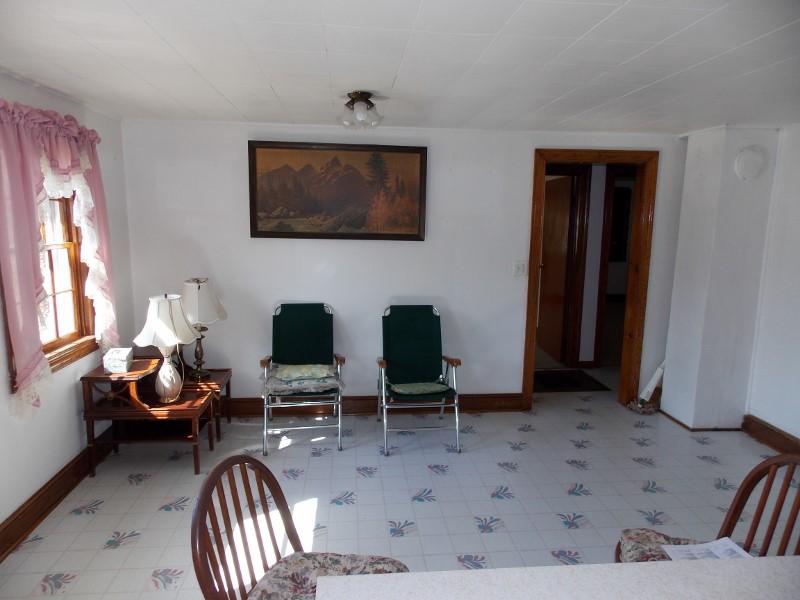 156 Rose Wood Road Woolwine, VA 24185 - Photo 27 of 29 a living room with furniture and a flat screen tv