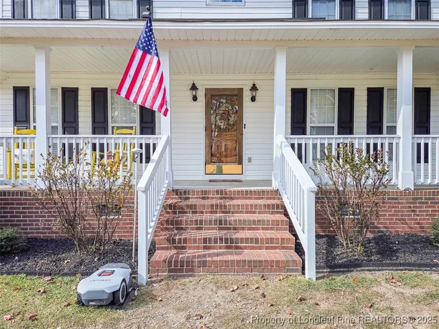 a front view of a house with a porch