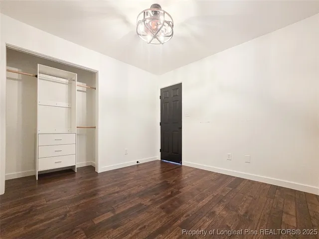 an empty room with wooden floor