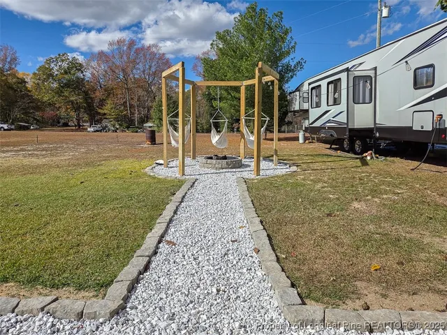 a view of a house with a yard porch and sitting area