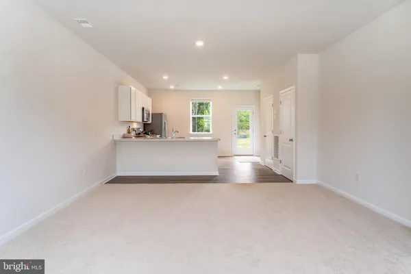 a view of a kitchen with a sink and cabinet
