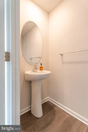 a bathroom with a sink and mirror