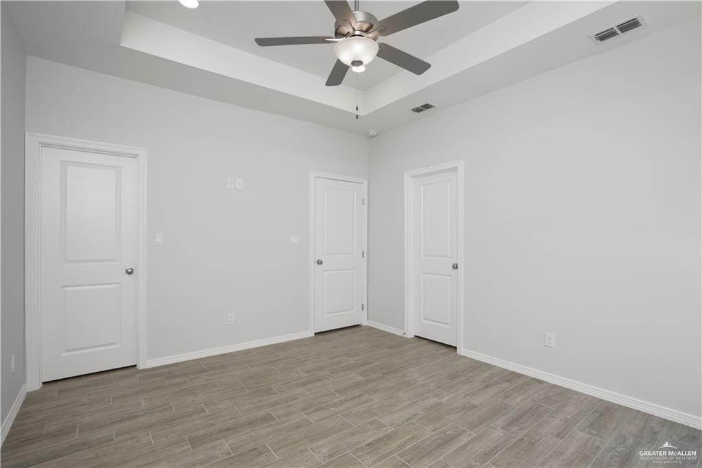 5900 Puffin Avenue, Unit 2 Mission, TX 78573 - Photo 16 of 32 wooden floor in an empty room