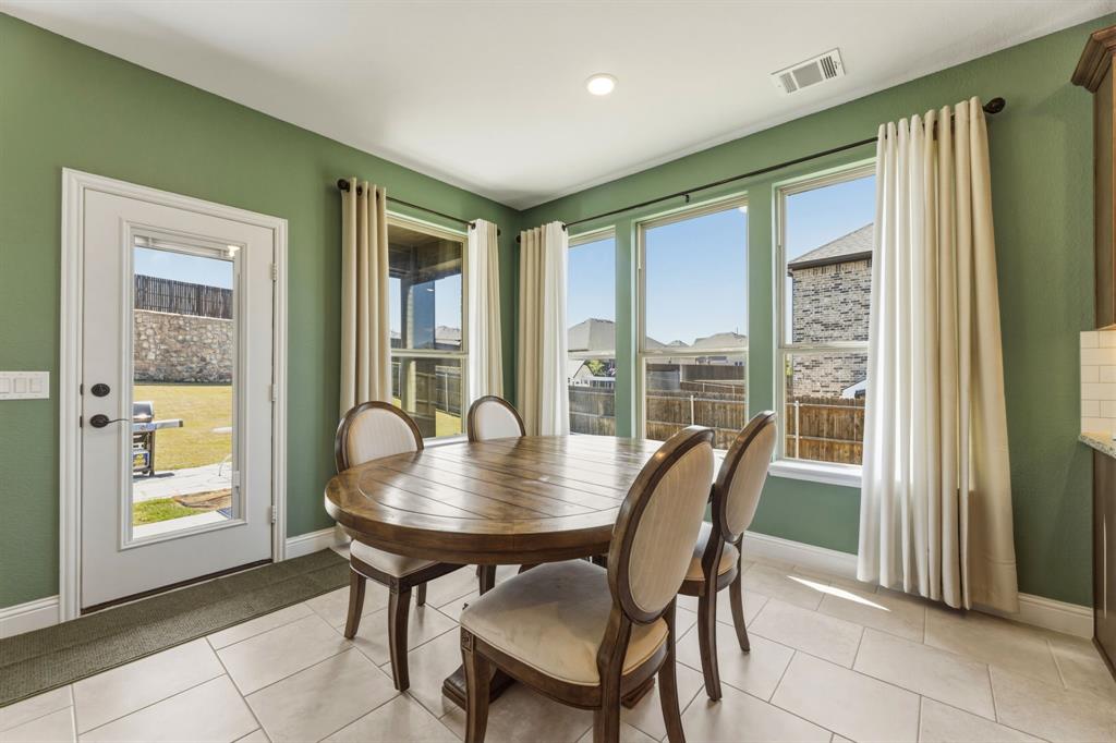 1030 Timber Ridge Drive Justin, TX 76247 - Photo 13 of 40 Dining space with light tile patterned floors