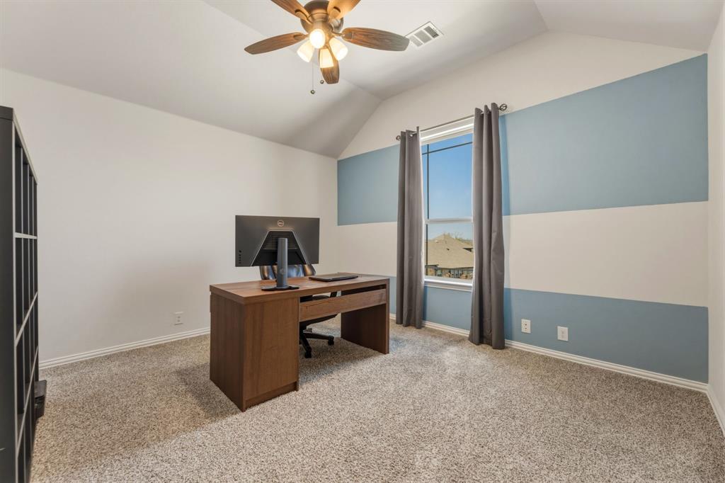 1030 Timber Ridge Drive Justin, TX 76247 - Photo 28 of 40 Bedroom with a ceiling fan, vaulted ceiling, and light colored carpet