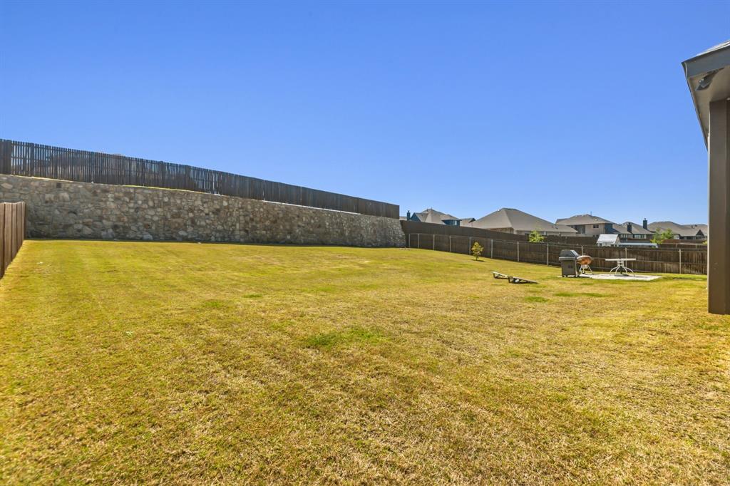 1030 Timber Ridge Drive Justin, TX 76247 - Photo 39 of 40 View of fenced backyard