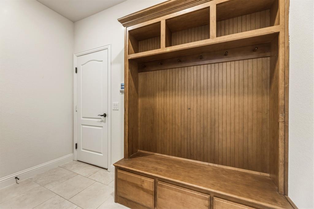 1030 Timber Ridge Drive Justin, TX 76247 - Photo 8 of 40 Mudroom with baseboards and light tile patterned flooring