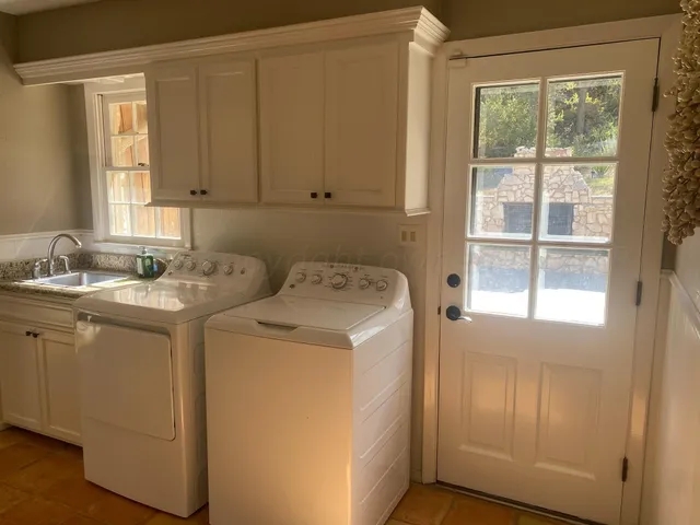 a utility room with dryer and washer
