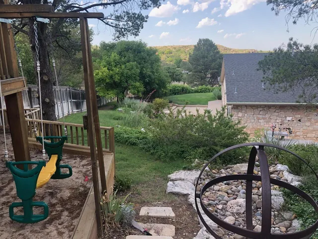 a view of a chair and tables in the patio