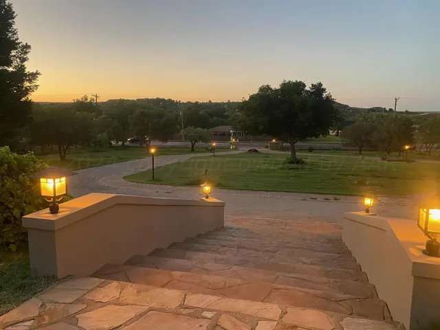 a view of a lake with a yard