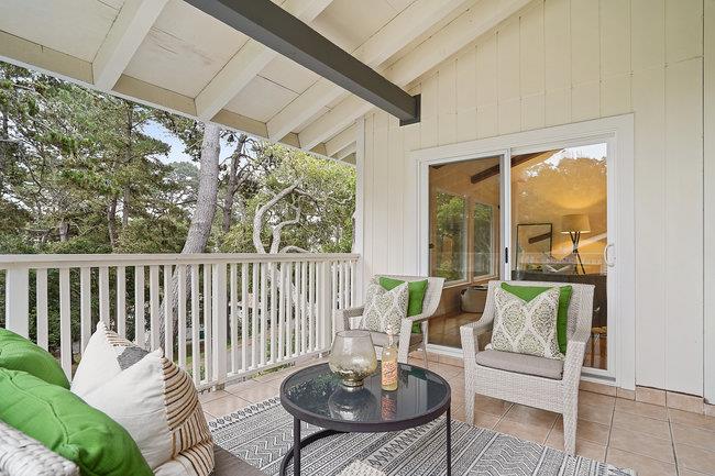 4076 Crest Road Pebble Beach, CA 93953 - Photo 12 of 46 a balcony with furniture and a potted plant