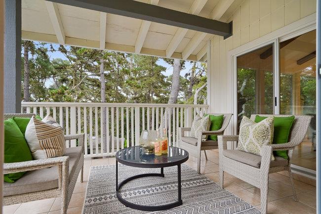 4076 Crest Road Pebble Beach, CA 93953 - Photo 13 of 46 a balcony with chairs and a table
