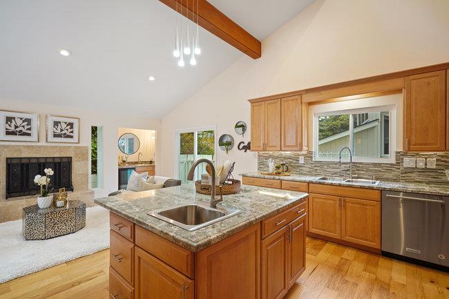 4076 Crest Road Pebble Beach, CA 93953 - Photo 20 of 46 a kitchen with granite countertop a sink and cabinets