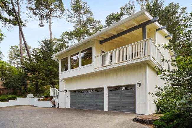 4076 Crest Road Pebble Beach, CA 93953 - Photo 2 of 46 a front view of a house with a garage