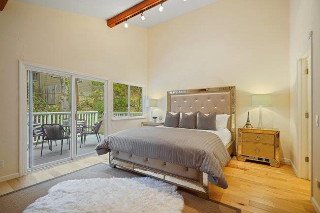 4076 Crest Road Pebble Beach, CA 93953 - Photo 29 of 46 a bedroom with a bed and large window