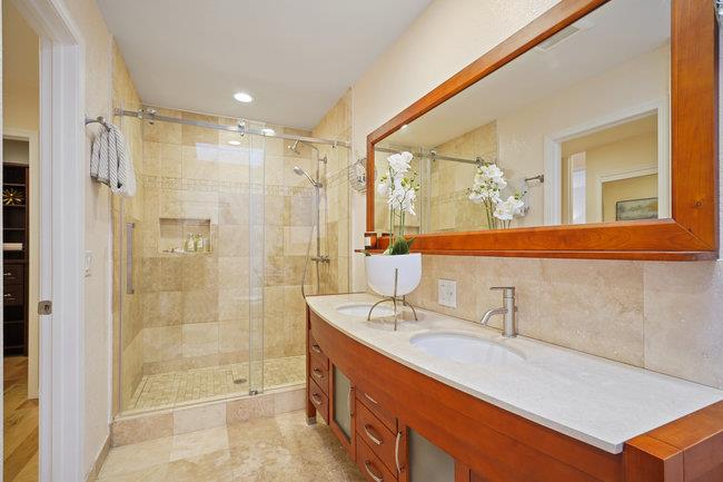 4076 Crest Road Pebble Beach, CA 93953 - Photo 34 of 46 a bathroom with a double vanity sink mirror and shower