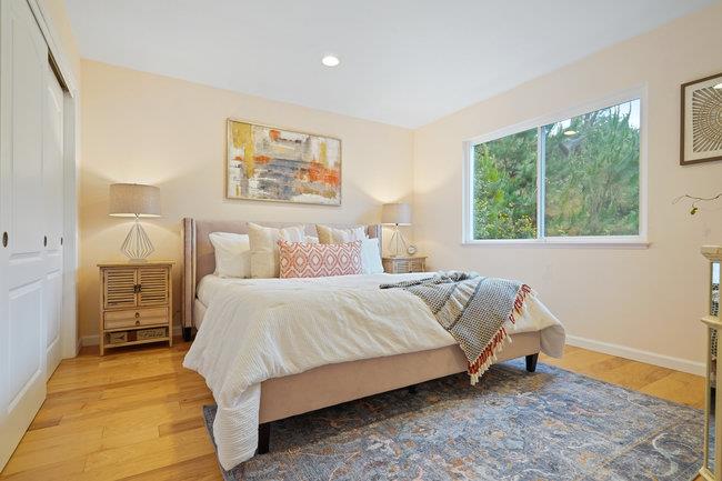 4076 Crest Road Pebble Beach, CA 93953 - Photo 36 of 46 a bedroom with a bed and wooden floor