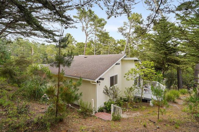 4076 Crest Road Pebble Beach, CA 93953 - Photo 43 of 46 a yellow house with trees in front of it