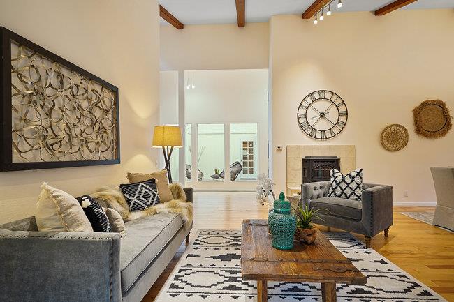 4076 Crest Road Pebble Beach, CA 93953 - Photo 8 of 46 a living room with furniture a clock and a fireplace