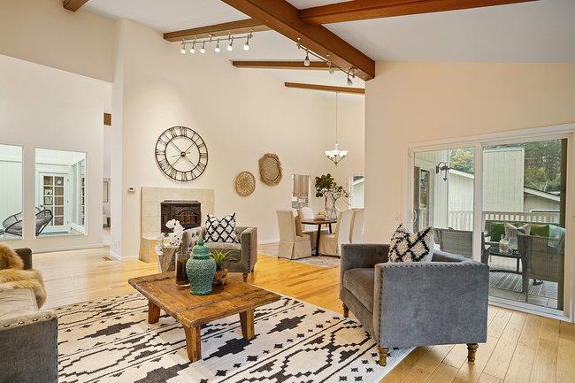 4076 Crest Road Pebble Beach, CA 93953 - Photo 9 of 46 a living room with furniture a clock on wall and a window