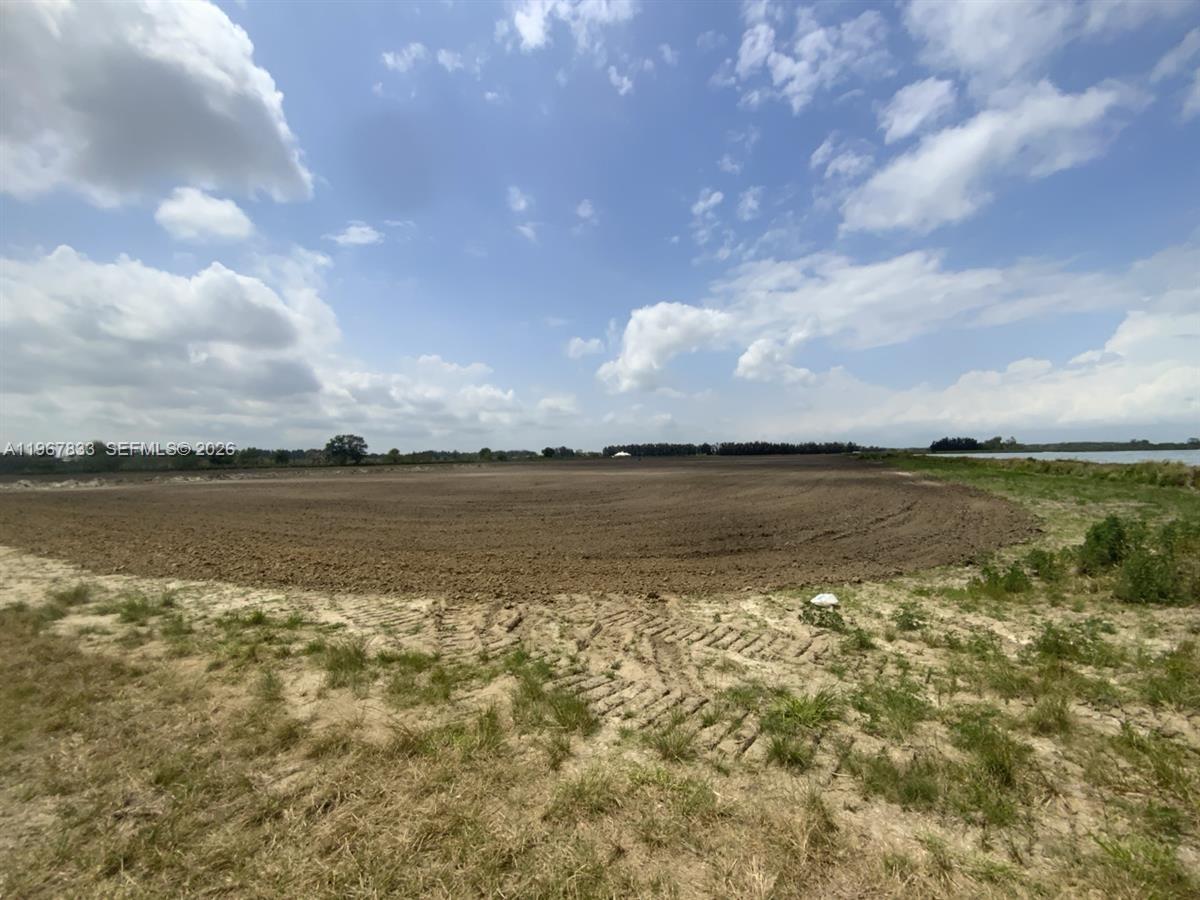 595 North Header Canal Road Fort Pierce, FL 34945 - Photo 12 of 12 a view of a lake from a yard