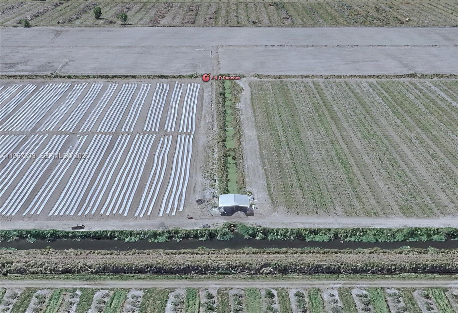 595 North Header Canal Road Fort Pierce, FL 34945 - Photo 8 of 12 a view of a backyard