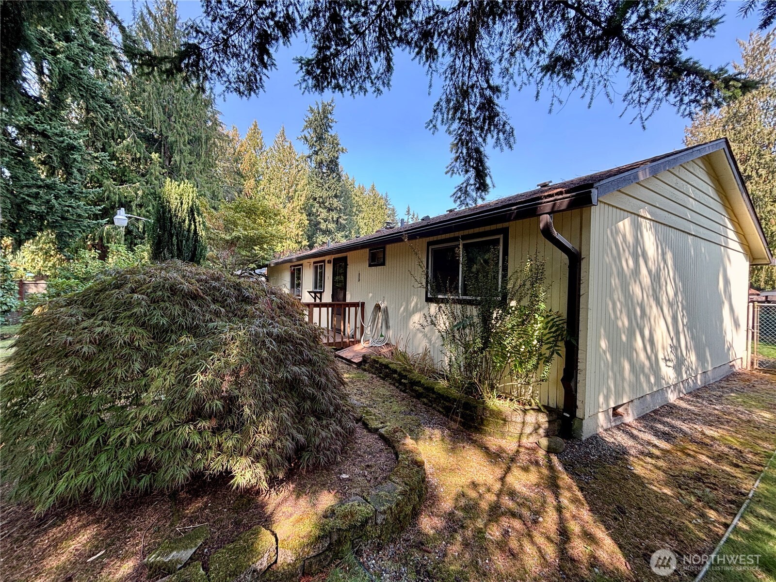 19304 3rd Drive Southeast Bothell, WA 98012 - Photo 12 of 24 a view of a house with a tree in the background