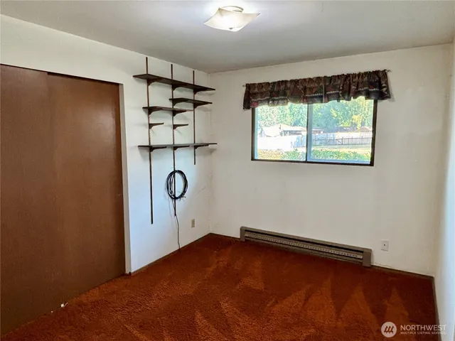 a view of room with window and air conditioner vent