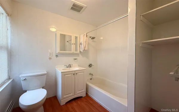 a bathroom with a toilet a sink and bathtub