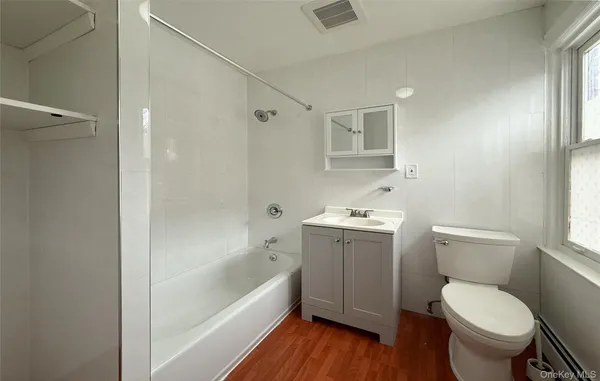 a bathroom with a sink toilet and bathtub