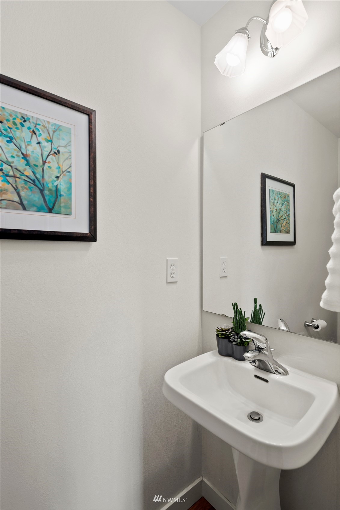 23120 Southeast Black Nugget Road, Unit H1 Issaquah, WA 98029 - Photo 11 of 27 a bathroom with a sink and a mirror