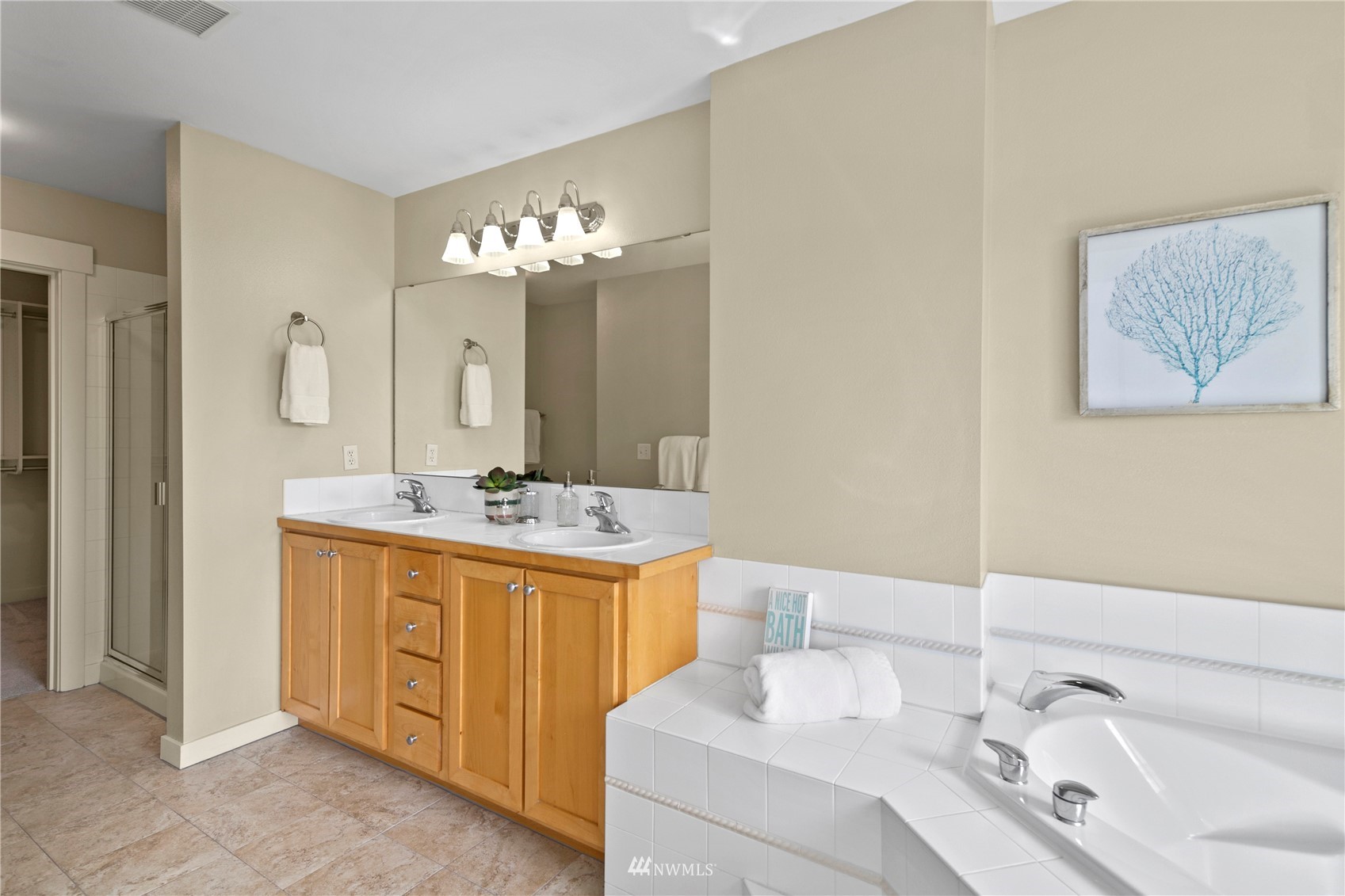 23120 Southeast Black Nugget Road, Unit H1 Issaquah, WA 98029 - Photo 17 of 27 a bathroom with a sink and a mirror