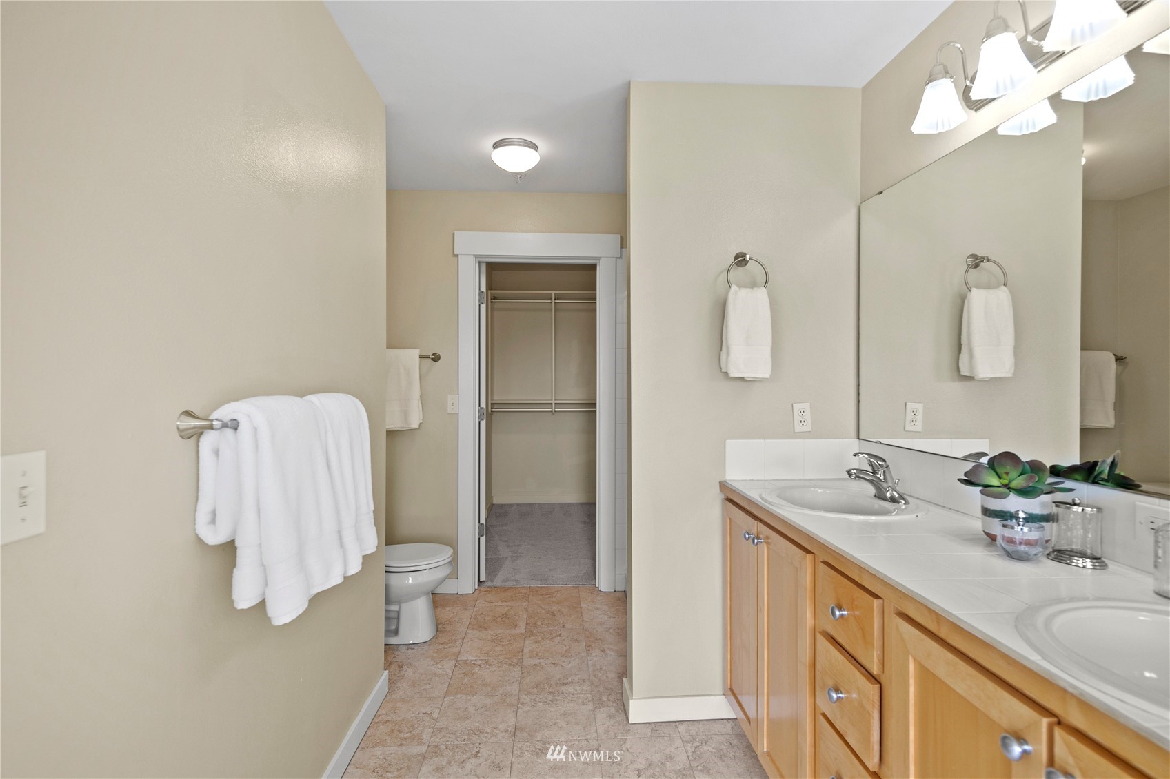 23120 Southeast Black Nugget Road, Unit H1 Issaquah, WA 98029 - Photo 18 of 27 a spacious bathroom with a double vanity sink mirror and shower