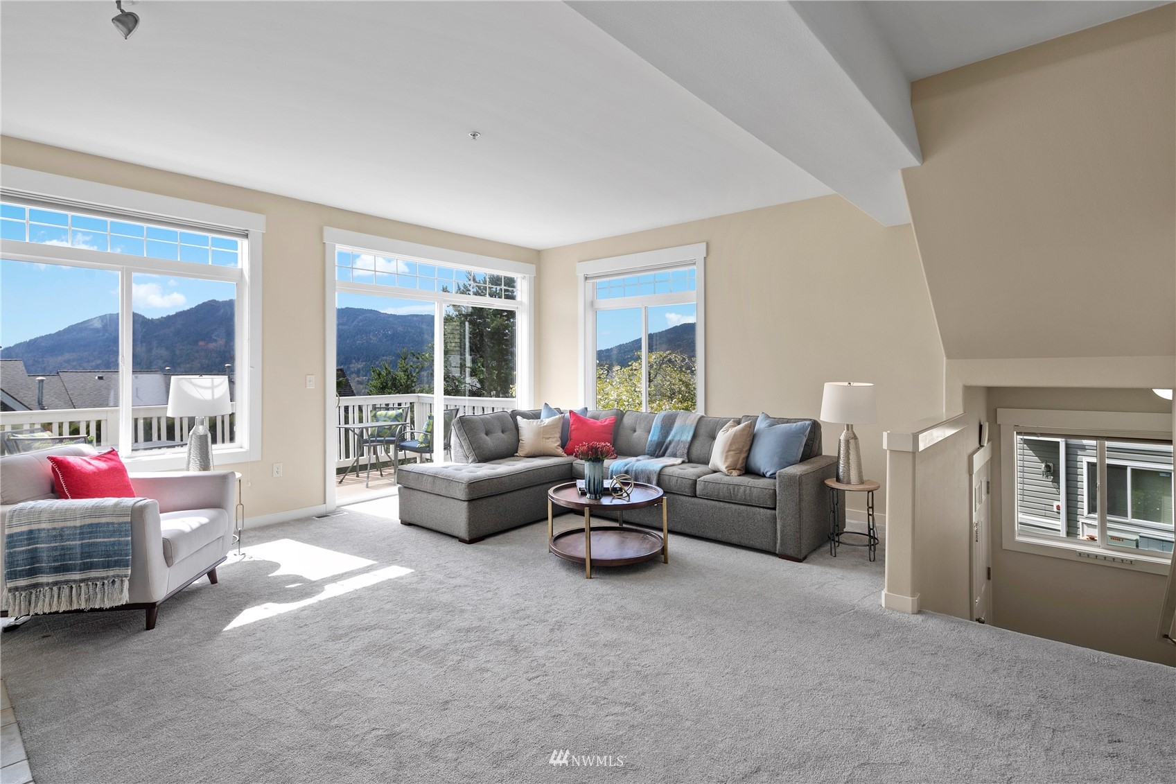 23120 Southeast Black Nugget Road, Unit H1 Issaquah, WA 98029 - Photo 4 of 27 a living room with furniture and a large window