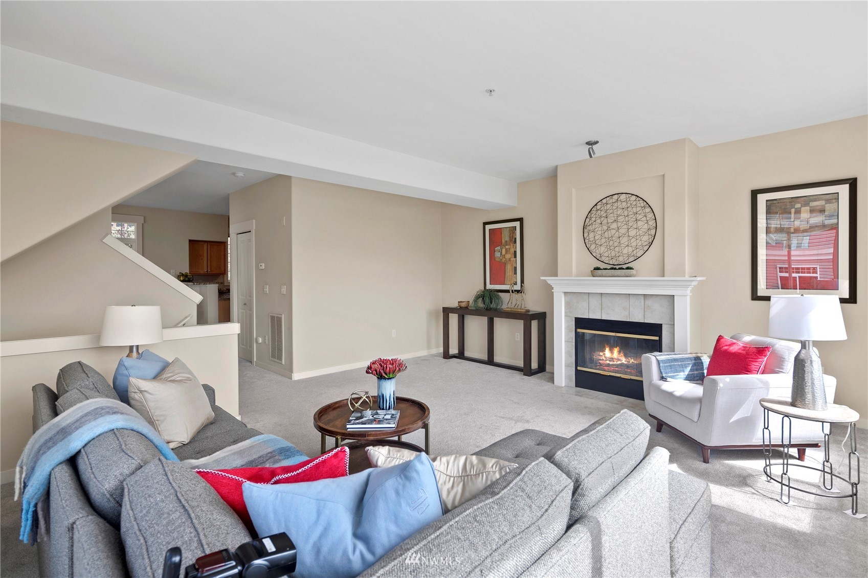 23120 Southeast Black Nugget Road, Unit H1 Issaquah, WA 98029 - Photo 5 of 27 a living room with furniture and a fireplace