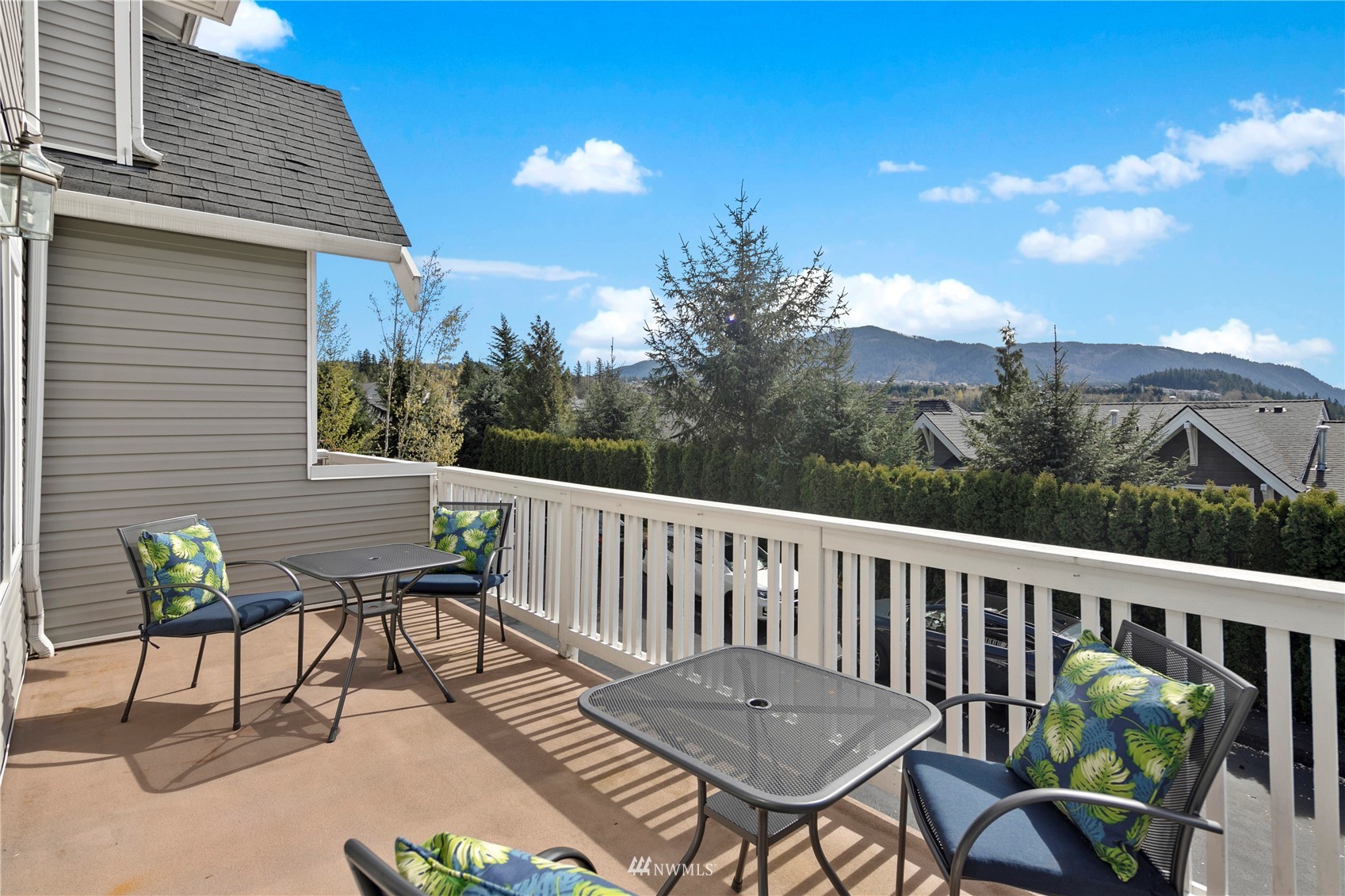 23120 Southeast Black Nugget Road, Unit H1 Issaquah, WA 98029 - Photo 6 of 27 a view of a chair and table on the deck