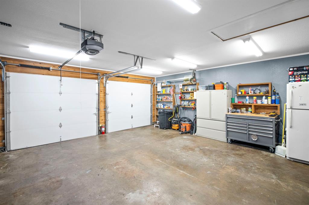 28 Coffee Tavern Road Bedford, TX 76022 - Photo 22 of 26 Finished out garage with air conditioning for these hot Texas summers