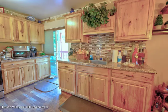 a kitchen with stainless steel appliances granite countertop a stove and cabinets