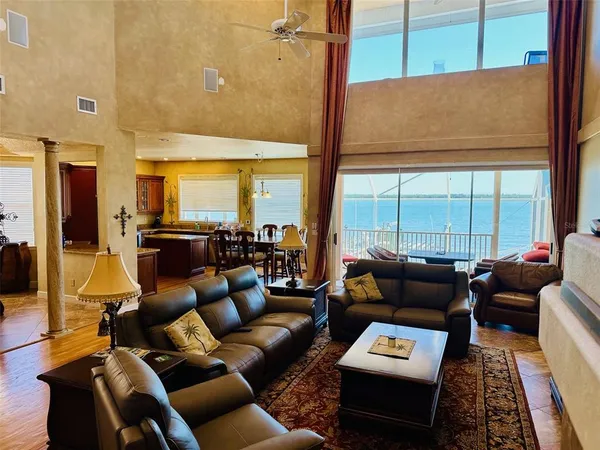 a living room with furniture wooden floor and a table