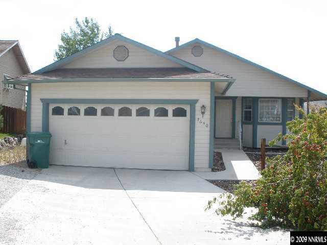 3640 Shale Court Reno, NV 89503 - Photo 1 of 6 a front view of a house with a garage