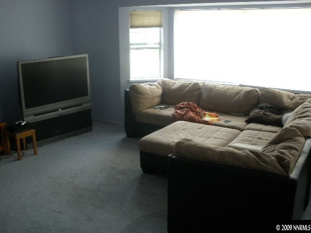 3640 Shale Court Reno, NV 89503 - Photo 2 of 6 a living room with a couch and a flat screen tv