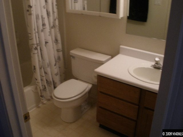 3640 Shale Court Reno, NV 89503 - Photo 5 of 6 a white toilet sitting next to a bathroom sink