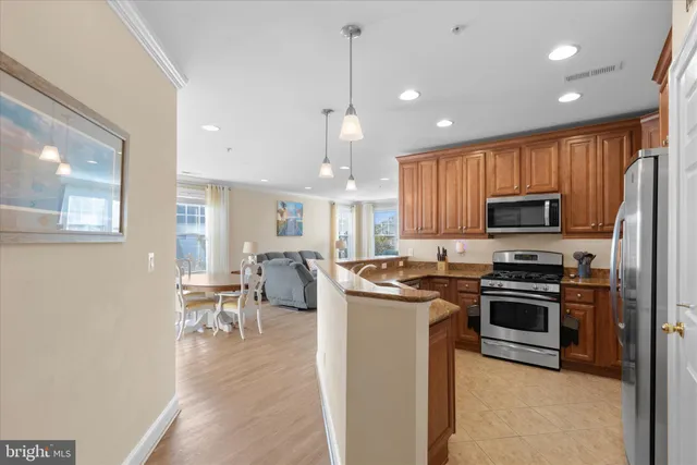 a kitchen with center island and sink