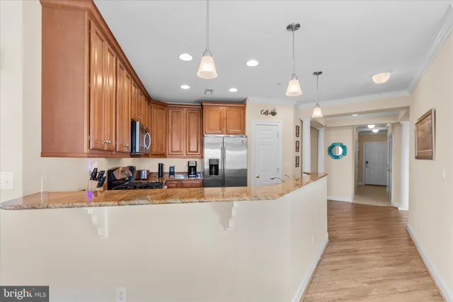 a workspace with wooden floor and a window